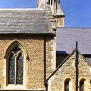 The completed chancel roof (right) in stark contrast with the aisle roof (left) which is in need of repair